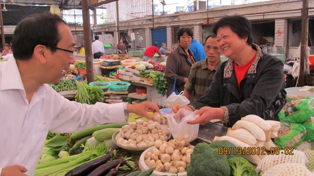 Chinese Grandmother helps me purchase vegetables when I first moved to China.  This woman is my favorite vendor.
