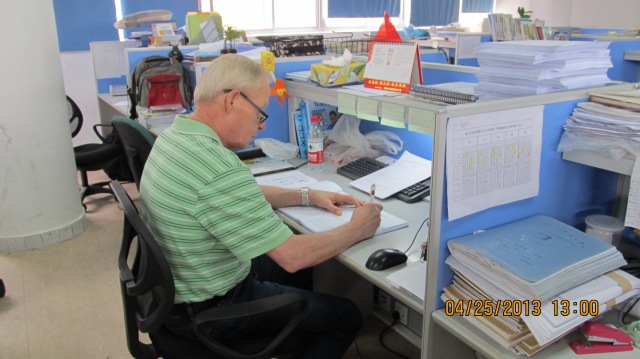 Bruce hard at work at his desk working the numbers.  He is Canadian and has a Chinese wife whom he met in Canada over 35 years ago.